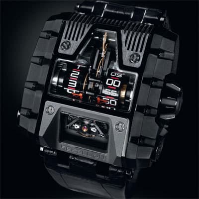 Механизм REB T-1000 состоит из 693 деталеи?, баланс с двои?нои? спиралью работает на частоте 18 000 пк/час и расположен под углом 39 о, запас хода 1000 часов обеспечивают 6 заводных барабанов
