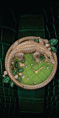 Часы-брошь Les Indomptables de Cartier с золотым крокодилом, украшенным бриллиантами и изумрудами